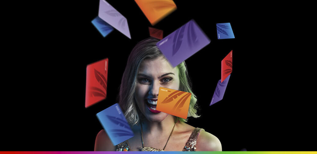 Girl standing in the middle of rewards club cards falling around her