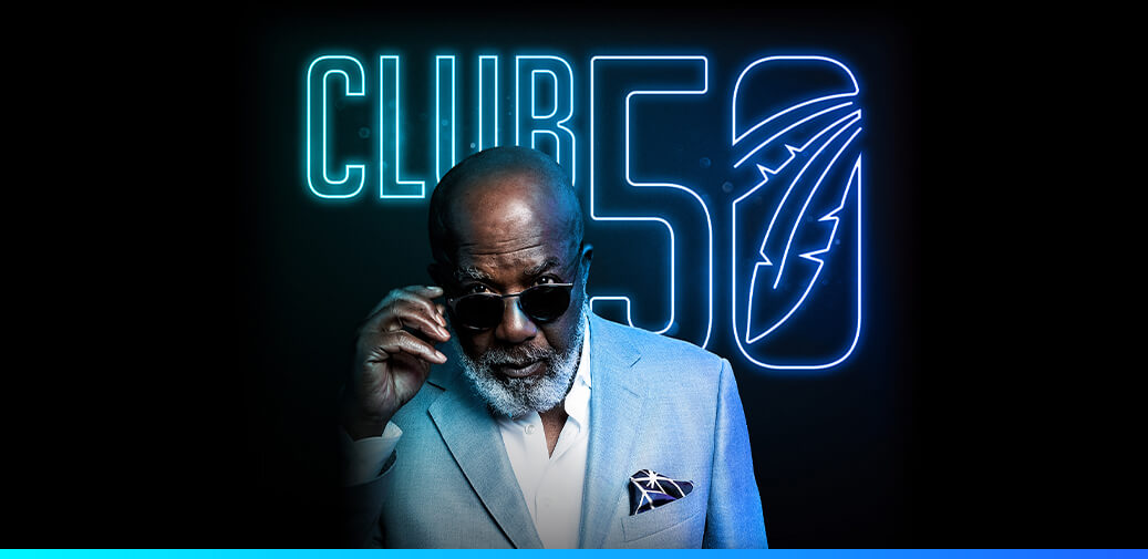 Man wearing sunglasses with club 50 logo