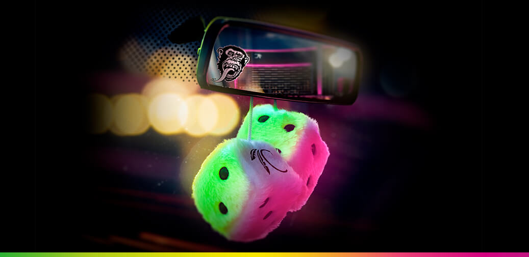 Fuzzy dice hanging from car mirror