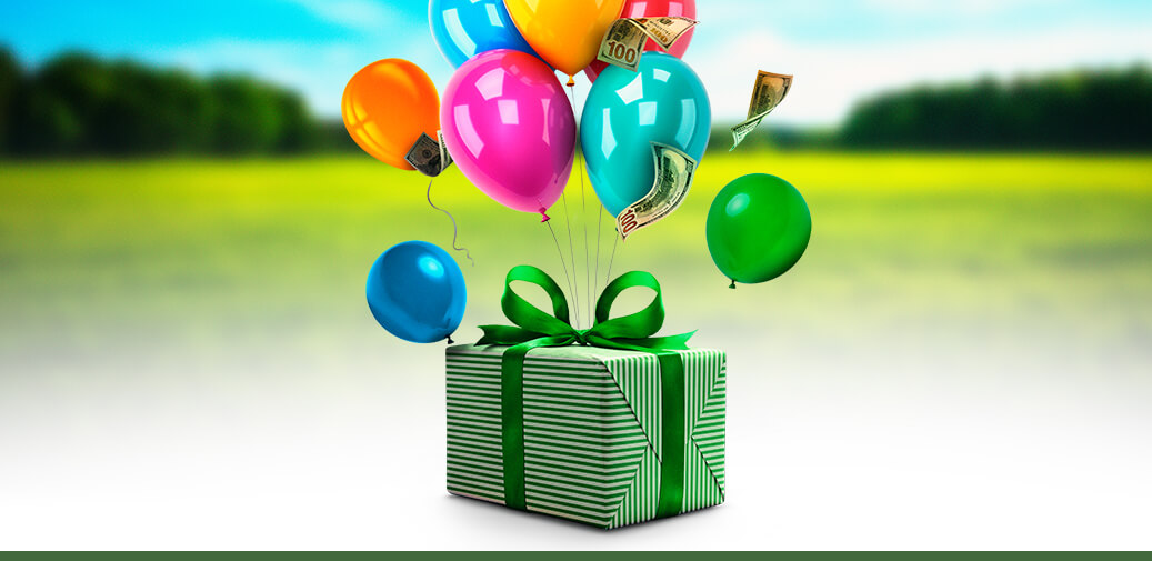 A gift box with balloons and money