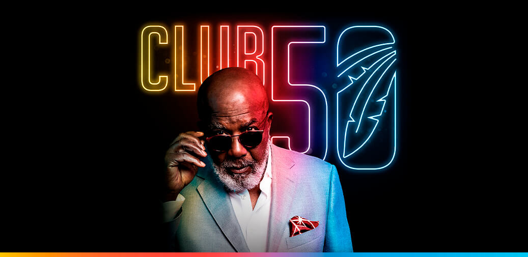 Man wearing sunglasses with club 50 logo