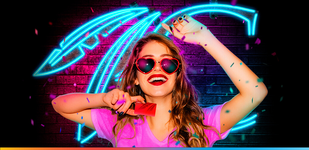 A lady holding a ruby rewards club card with confetti falling everywhere