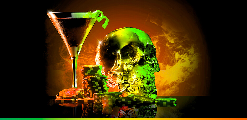 A martini with table game chips and a silver skeleton