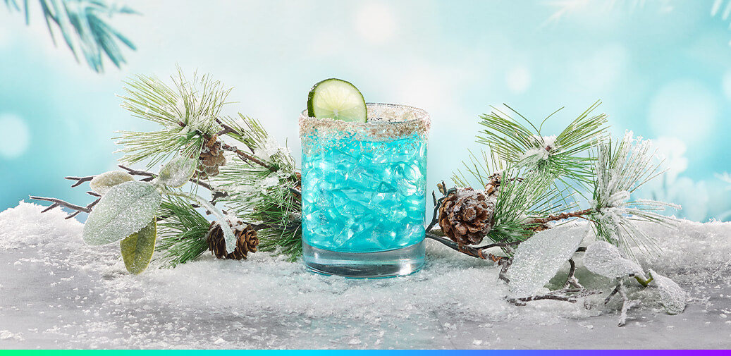 Blue margarita with a salt rim and a lime