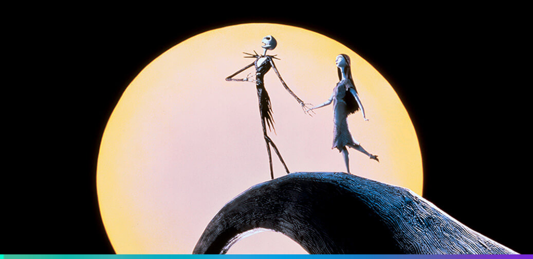 Jack Skellington and Sally on top of hill with the moon behind them