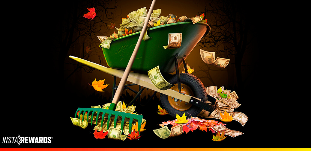 Wheel barrel full of money and leaves and a rake