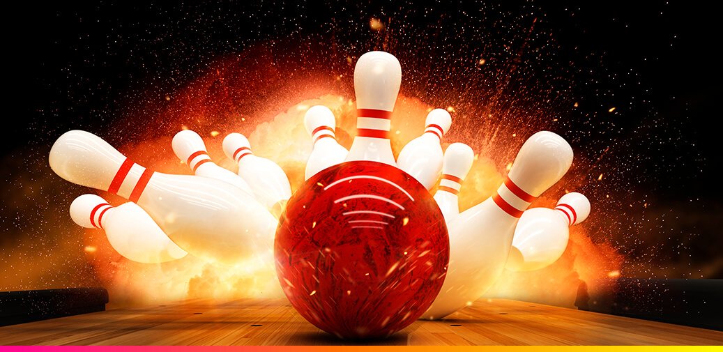 Red bowling ball hitting some pins