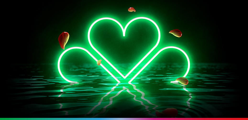 Four leaf clover peeping over water