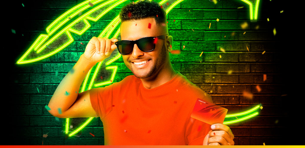 Portrait of a guy holding a Rewards Club Card.