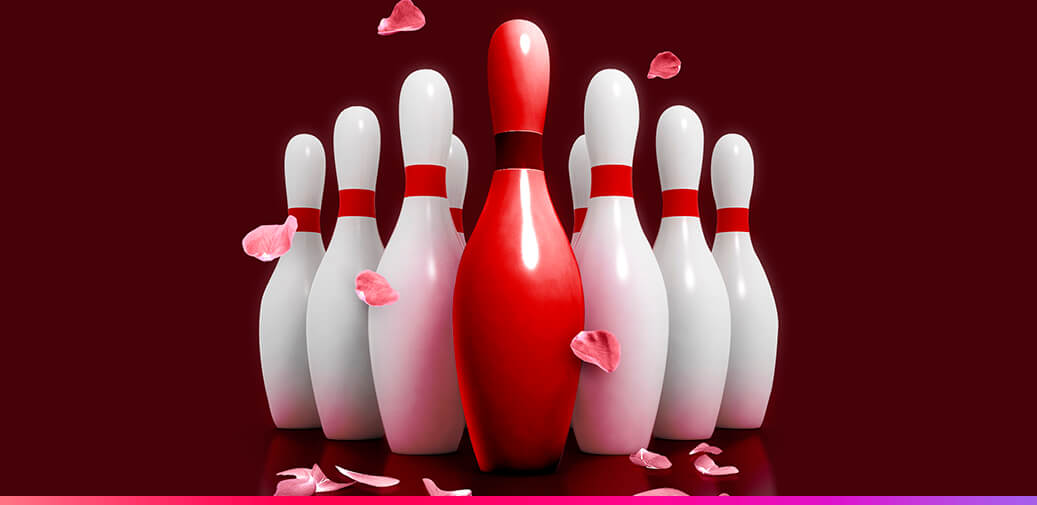 Bowling pins with a red pin in the head position