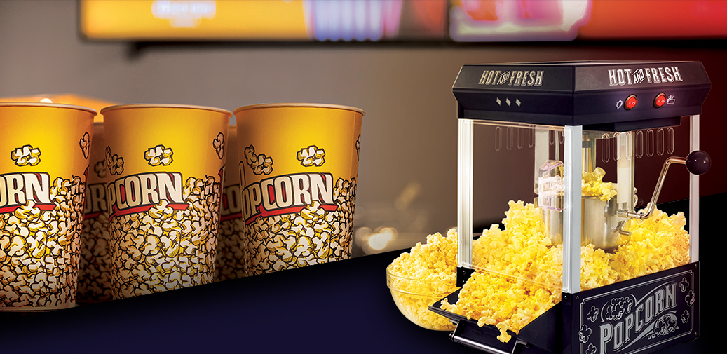 Popcorn machine with popcorn buckets next to it!