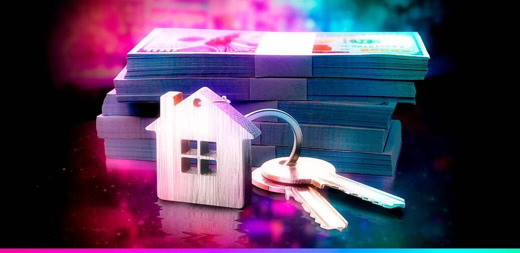 House keys with stacks of money behind it