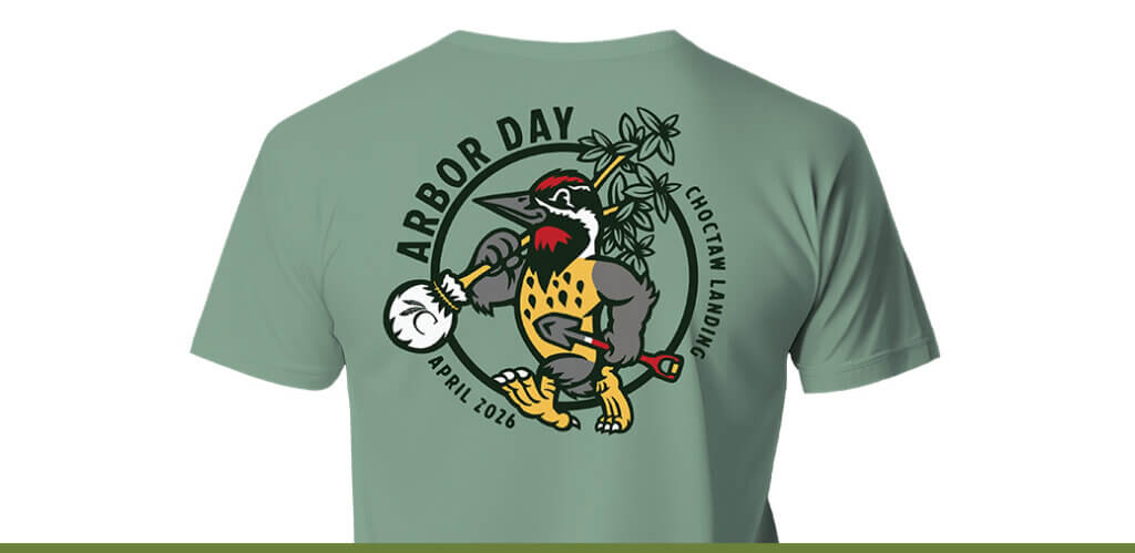 T-shirt that says Arbor Day and a cartoon Woodpecker holding a tree and shovel