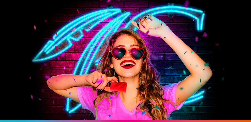 Girl wearing sunglasses and holding a rewards card