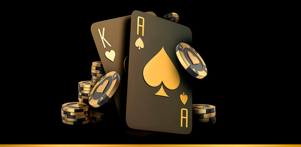 Playing cards and casino chips on a dark background.