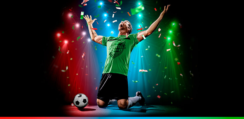 Soccer player celebrating a victory with confetti falling.