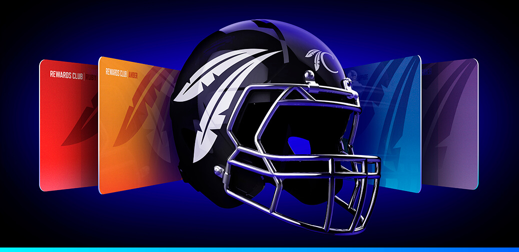 Football helmet with feather graphics against a dark background.