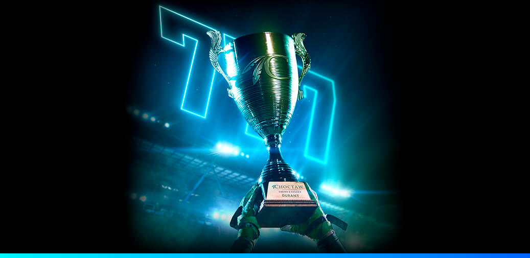 Triple 7's behind a trophy