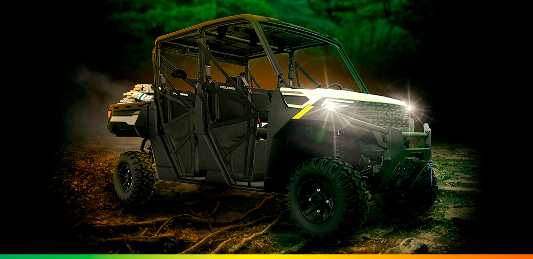 Two images of a black four-seat off-road vehicle with its headlights shining.