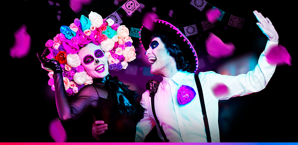 Performers in Day of the Dead costumes.